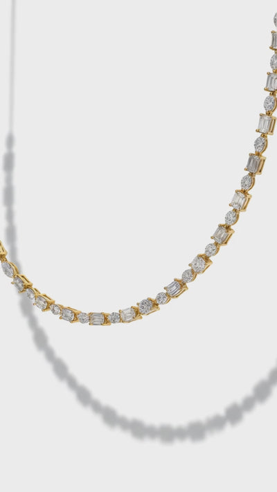 a close up video of a necklace , 2.20 carats of natural diamonds in a sophisticated multishape design, combining baguette, marquise, and pear cuts.