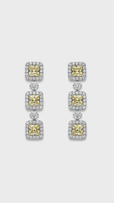 a video of 5.46 TCW Princess Cut Natural Yellow Diamond Drop Earrings